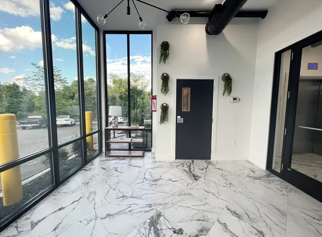 a view of a room with large windows