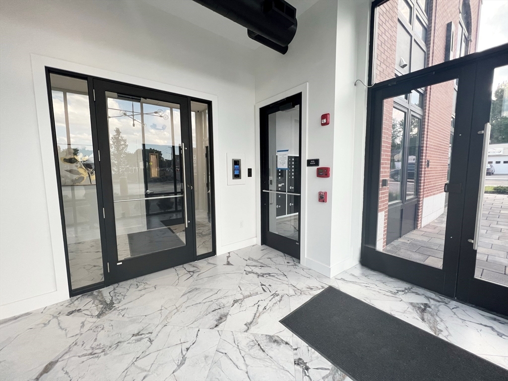 80 Bridge Street, Unit 303 Dedham, MA 02026 - Photo 3 of 18 a view of a bathroom with a window
