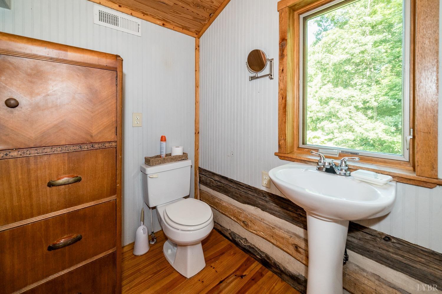 704 Peters Hollow Road Monroe, VA 24574 - Photo 24 of 55 a bathroom with a sink toilet and shower