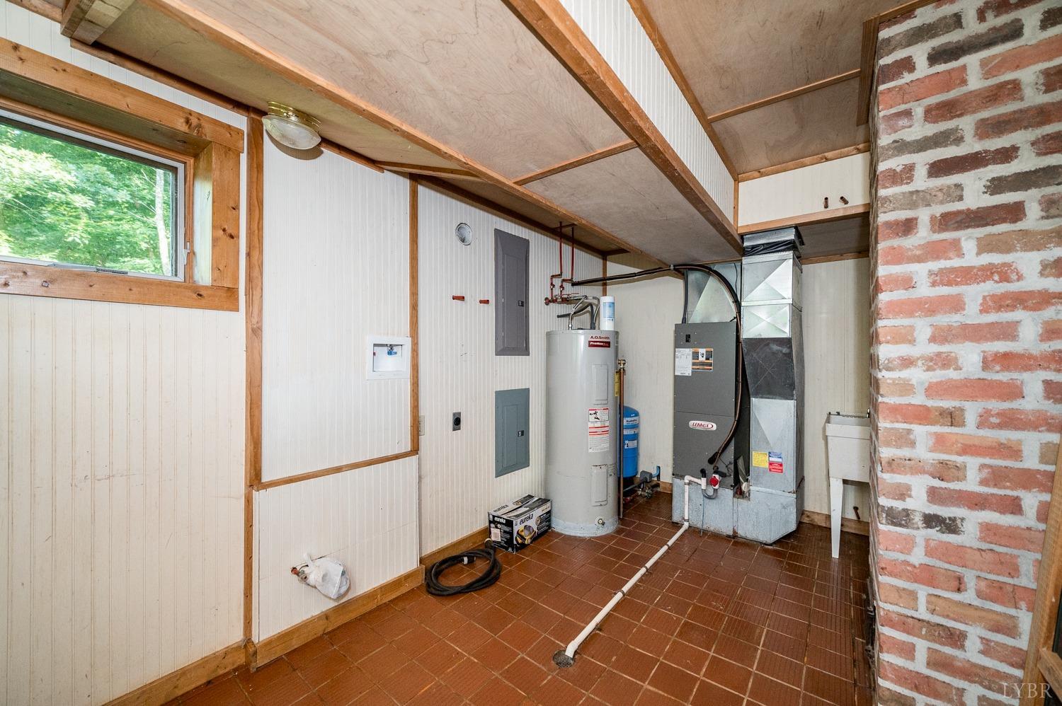 704 Peters Hollow Road Monroe, VA 24574 - Photo 29 of 55 a view of a hallway with bathroom and sink