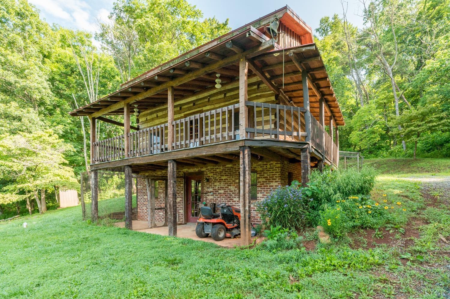704 Peters Hollow Road Monroe, VA 24574 - Photo 3 of 55 a front view of a house with garden