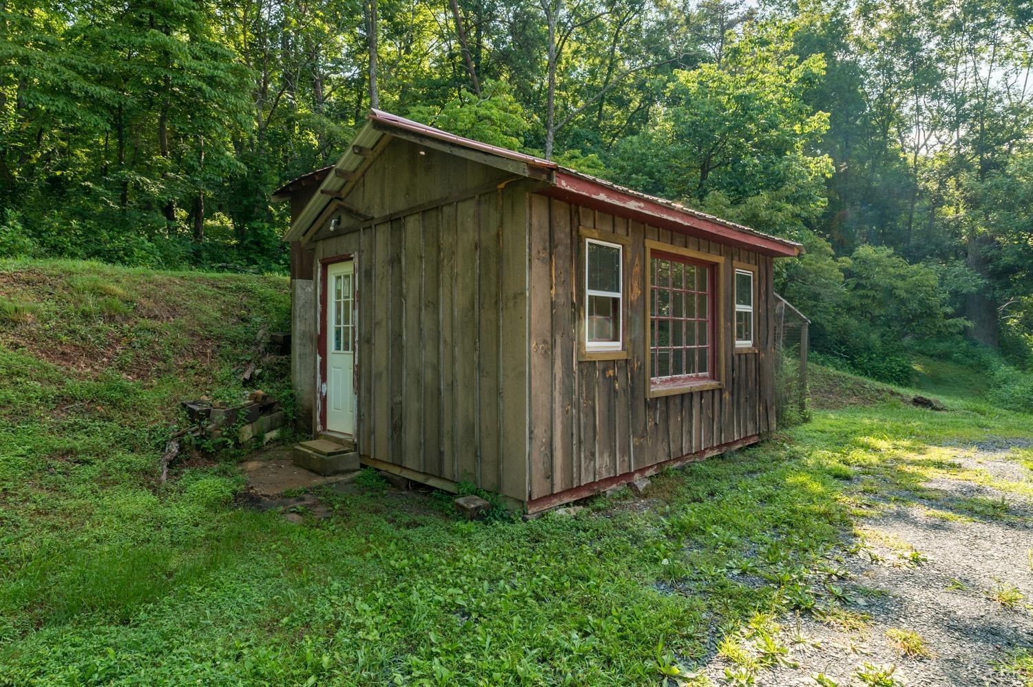 704 Peters Hollow Road Monroe, VA 24574 - Photo 32 of 55 a backyard of a house with lots of green space