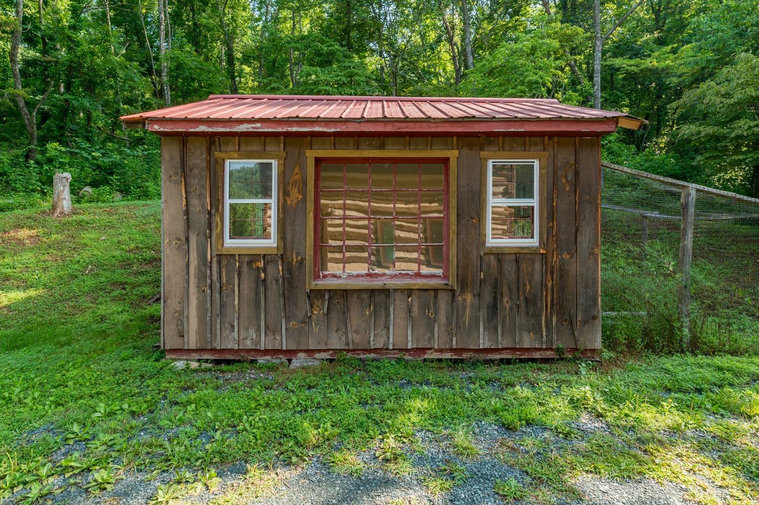 704 Peters Hollow Road Monroe, VA 24574 - Photo 33 of 55 a view of a house with a wooden fence