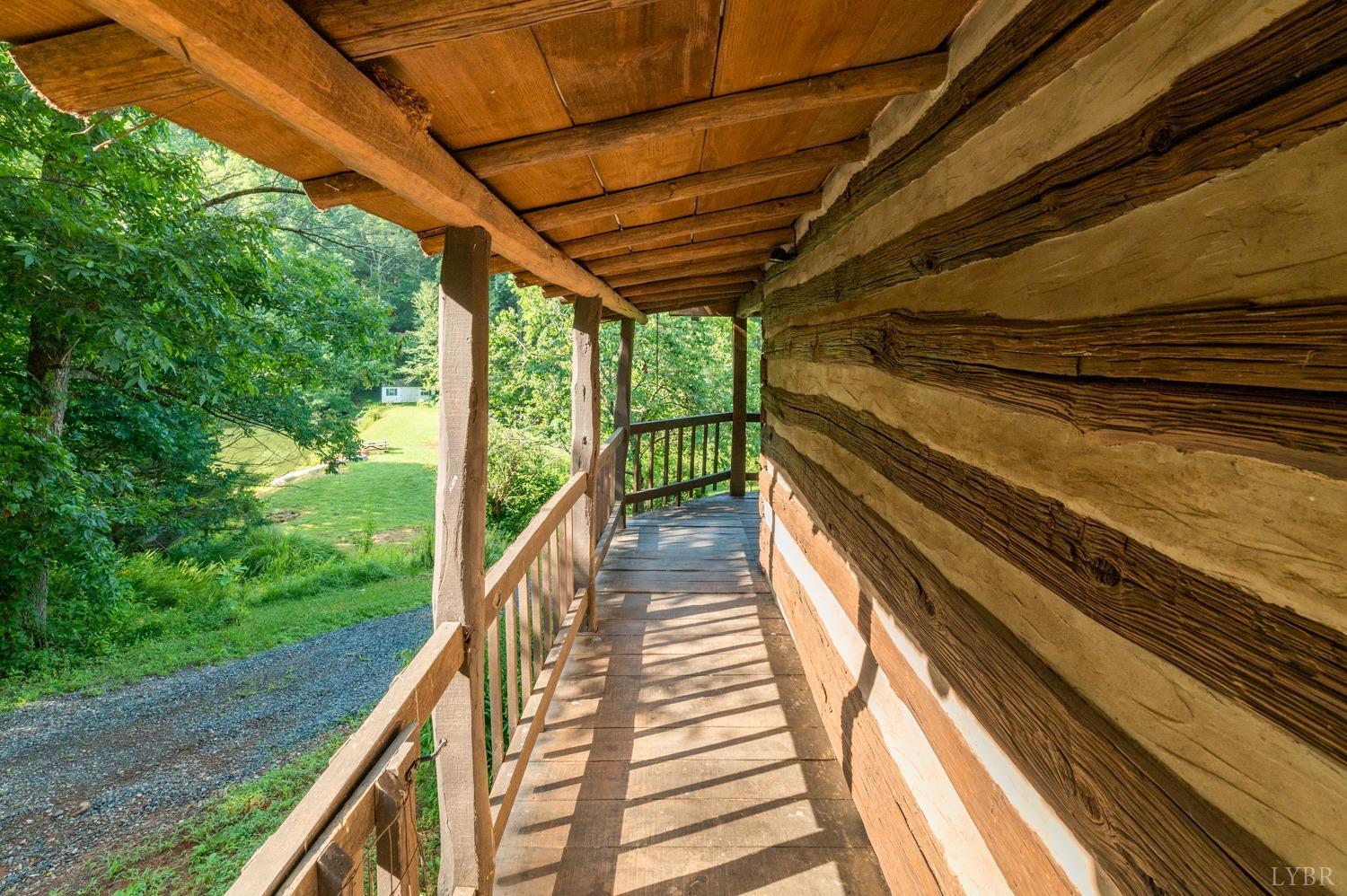 704 Peters Hollow Road Monroe, VA 24574 - Photo 6 of 55 a view of balcony with wooden floor and outdoor space