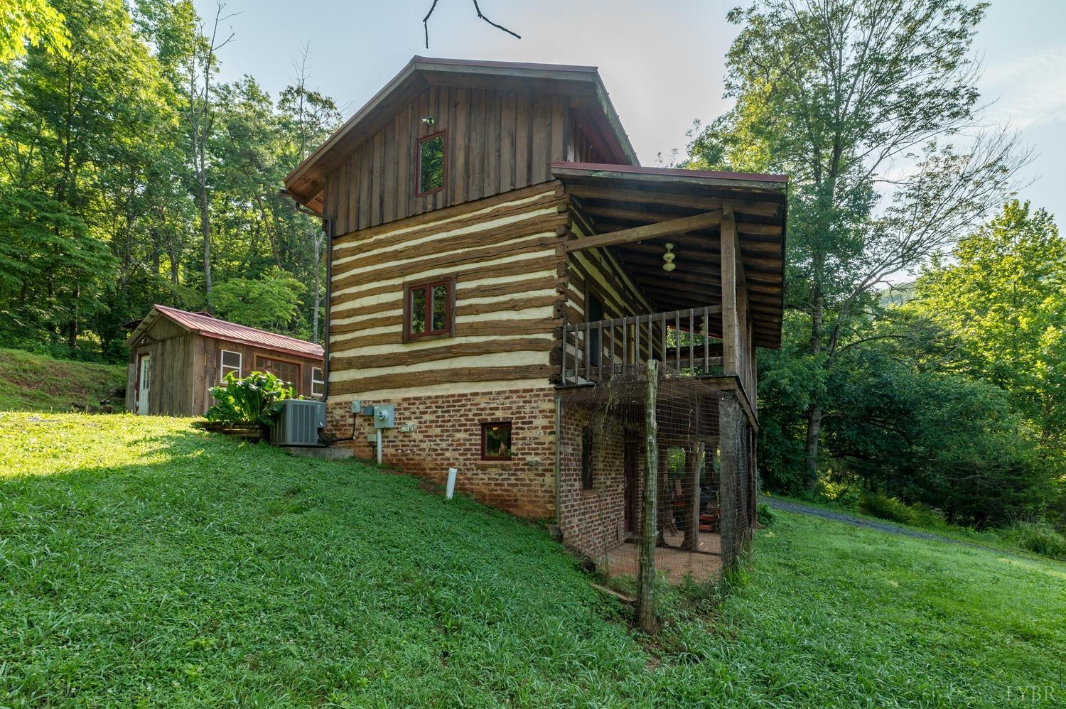 704 Peters Hollow Road Monroe, VA 24574 - Photo 9 of 55 a view of a house with backyard and garden