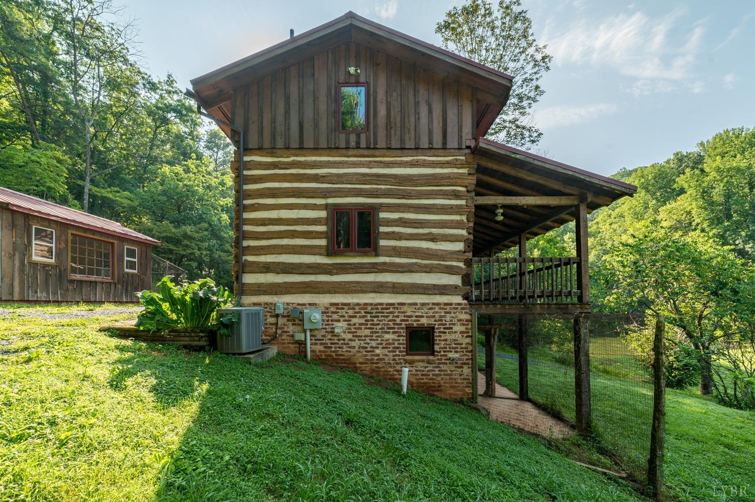 704 Peters Hollow Road Monroe, VA 24574 - Photo 10 of 55 a front view of a house with garden