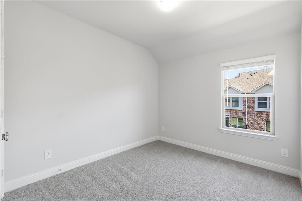519 Sequoia Street Allen, TX 75002 - Photo 32 of 38 Neutral-toned room featuring a single window with blinds, light gray wall paint, and gray carpeting