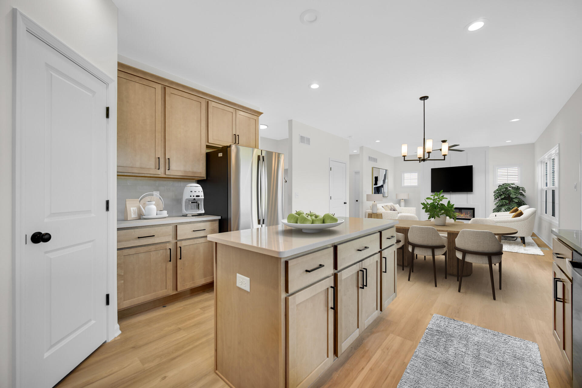 86 Bergamo Court Crown Point, IN 46307 - Photo 5 of 15 a kitchen with kitchen island granite countertop appliances cabinets and a dining table