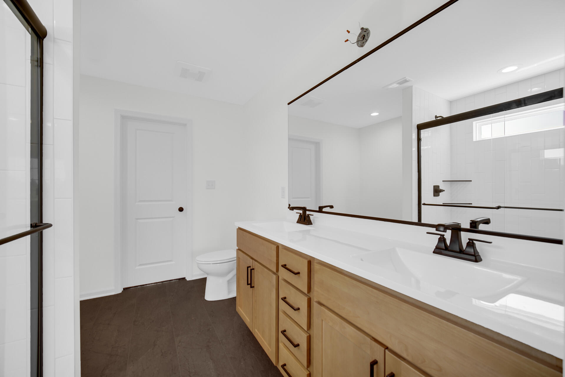 86 Bergamo Court Crown Point, IN 46307 - Photo 10 of 15 a spacious bathroom with a double vanity sink a mirror and shower