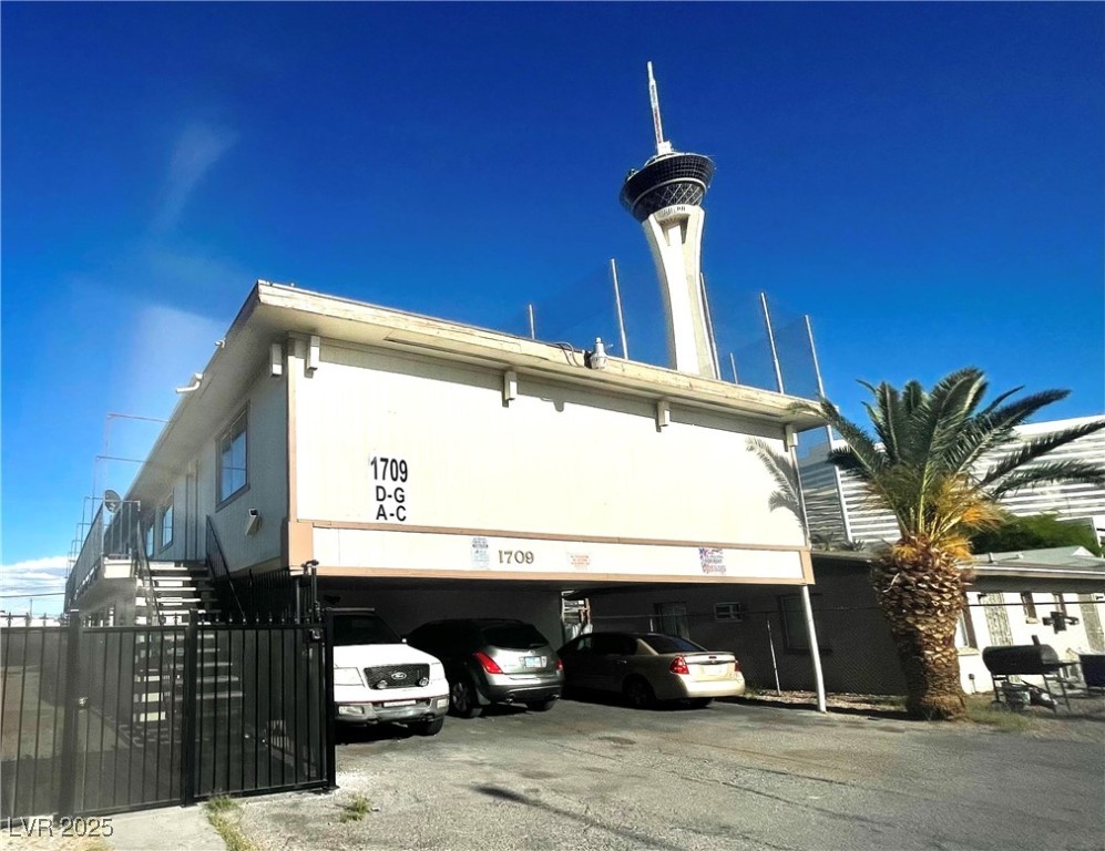 1709 Fairfield Avenue, Unit G Las Vegas, NV 89102 - Photo 2 of 15 View of property with stairway and a carport