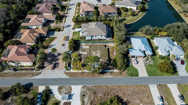 an aerial view of a houses with a yard