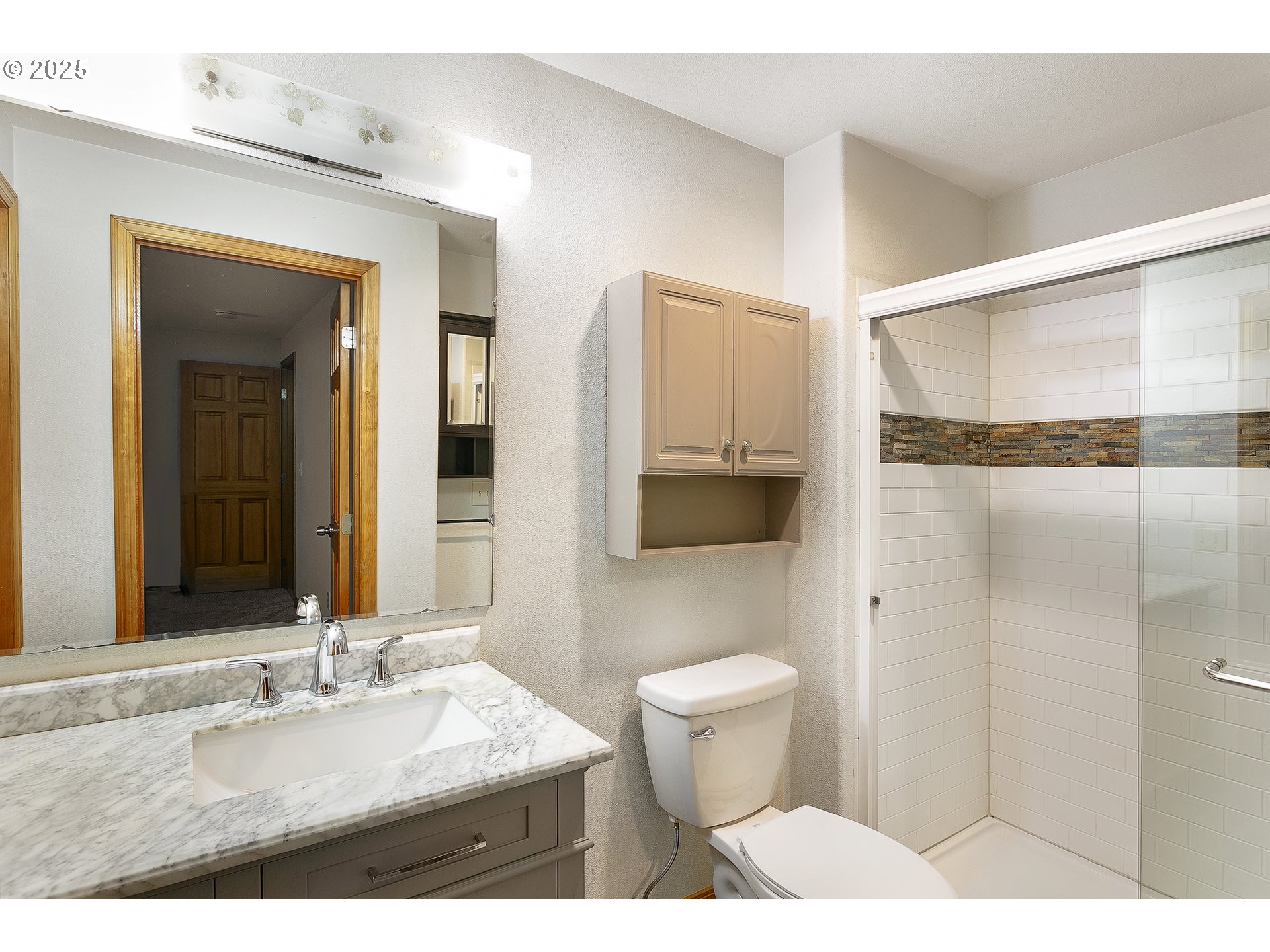 132 Southeast 214th Avenue Gresham, OR 97030 - Photo 14 of 27 a bathroom with a sink toilet a mirror and shower