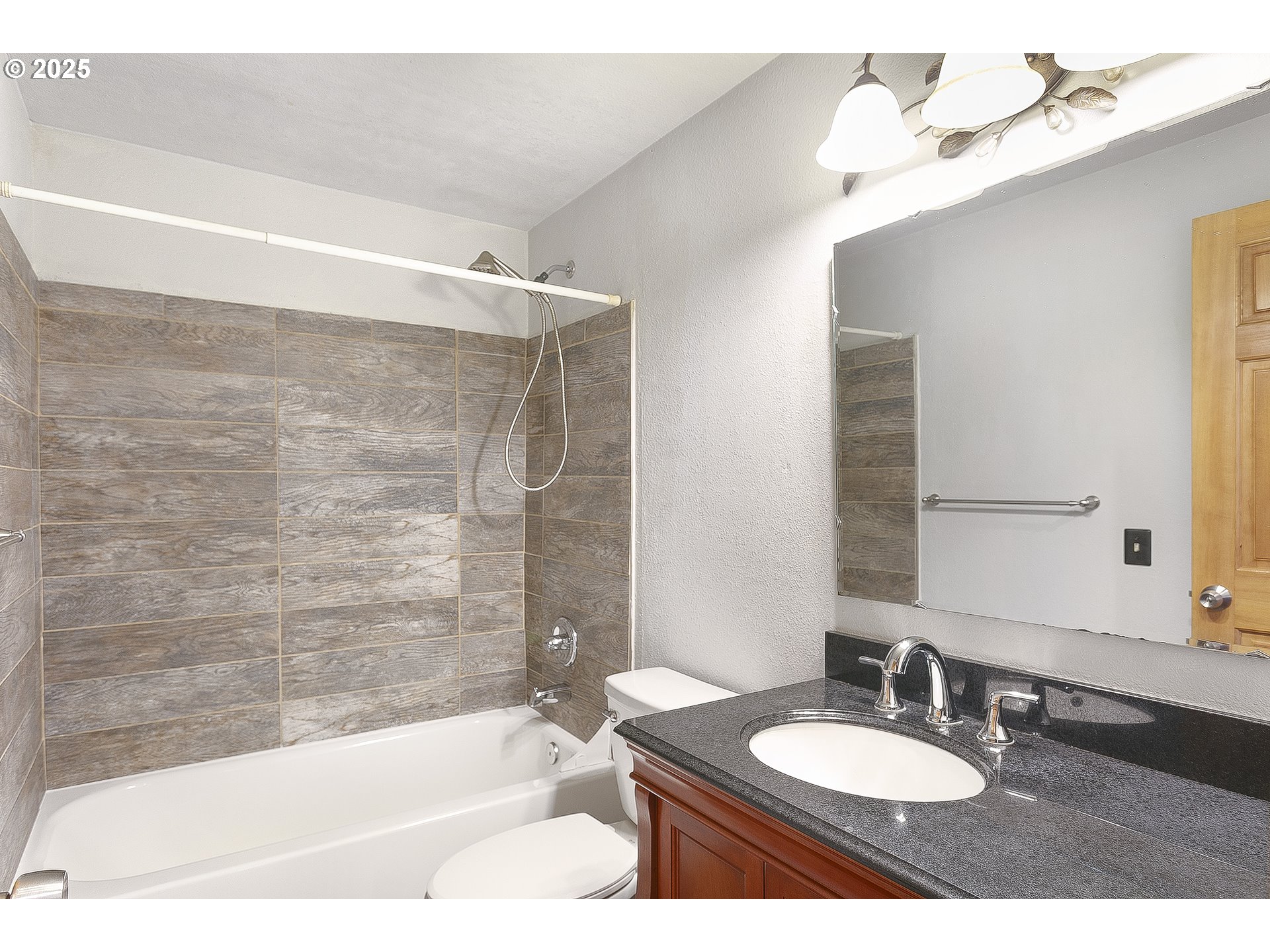132 Southeast 214th Avenue Gresham, OR 97030 - Photo 16 of 27 a bathroom with a bathtub and a sink
