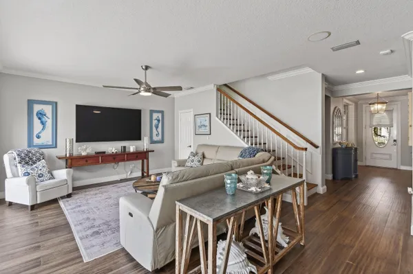 a kitchen with granite countertop white cabinets and stainless steel appliances
