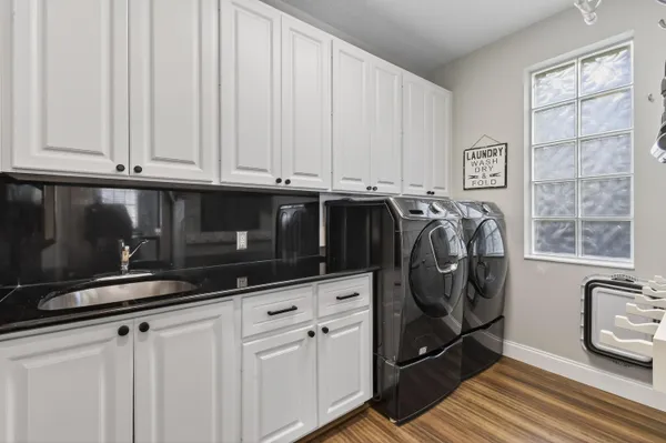 a room view with wooden floor and staircase