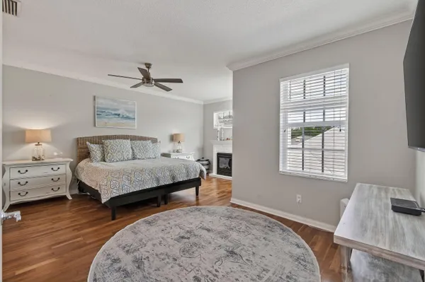 a spacious bathroom with a granite countertop sink and a mirror
