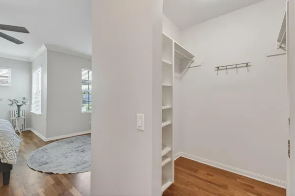 a spacious bedroom with a bed and a couch