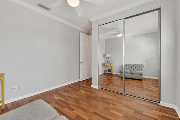 a view of a backyard with plants and outdoor seating