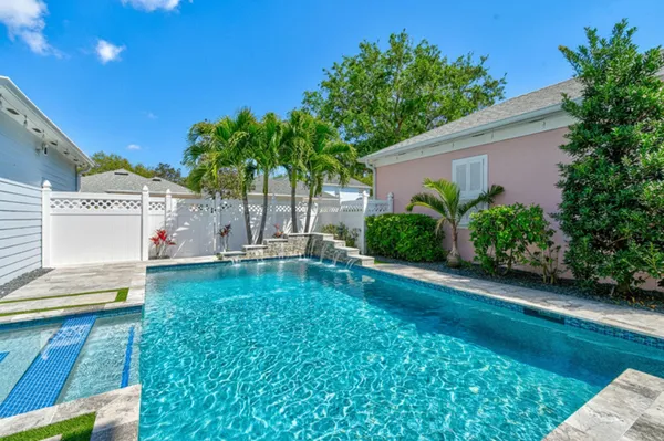a view of a backyard with a garden and plants