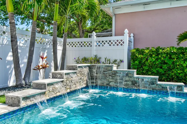 a view of swimming pool with a patio