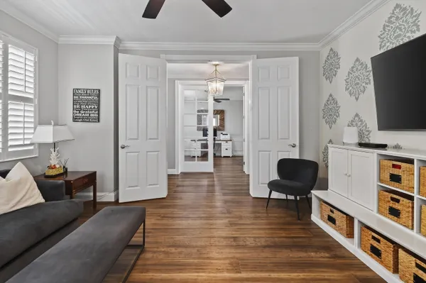 a living room with furniture and a flat screen tv