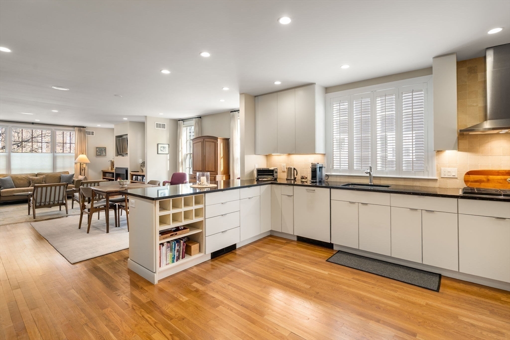 16 York Terrace Brookline, MA 02446 - Photo 12 of 42 a kitchen with stainless steel appliances granite countertop a stove a sink and a refrigerator