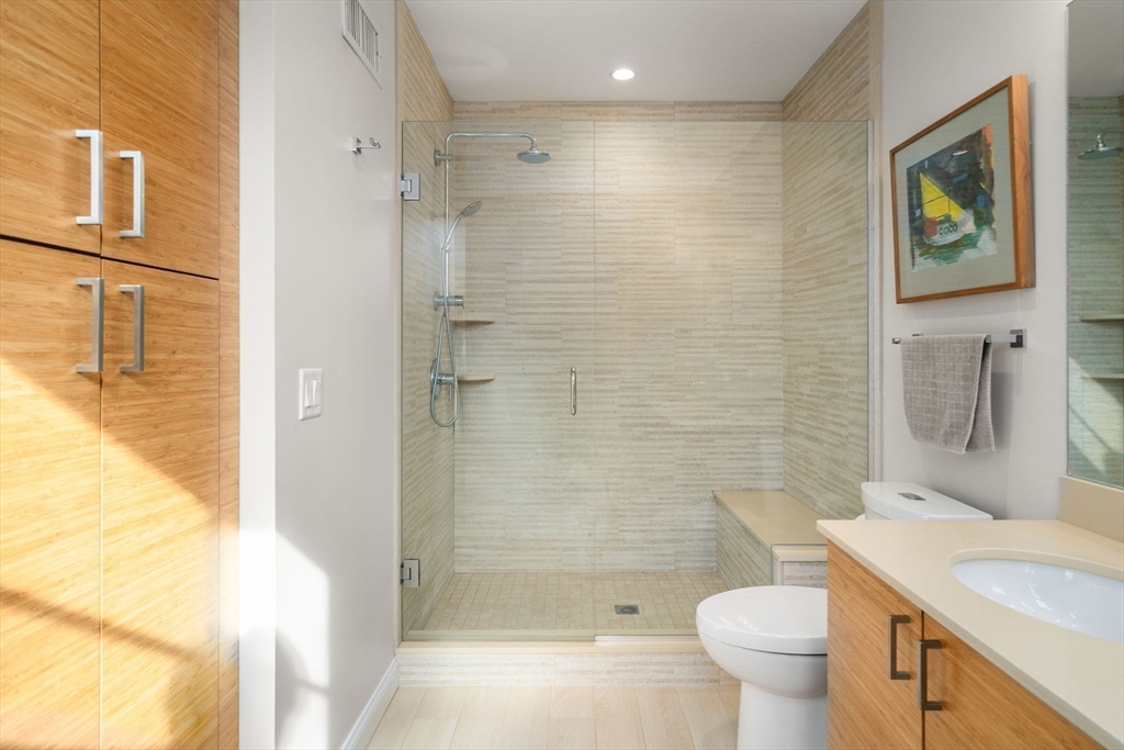 16 York Terrace Brookline, MA 02446 - Photo 21 of 42 a bathroom with a granite countertop sink toilet and shower
