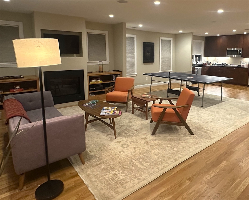 16 York Terrace Brookline, MA 02446 - Photo 24 of 42 a living room with furniture and a flat screen tv