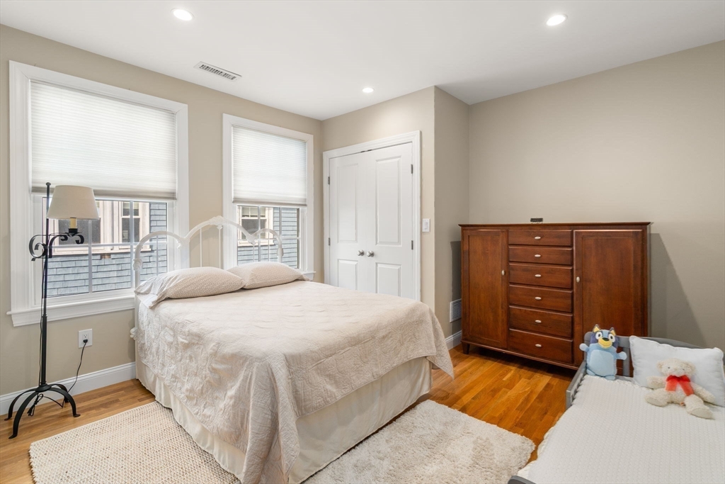 16 York Terrace Brookline, MA 02446 - Photo 31 of 42 a bedroom with a bed and a dresser