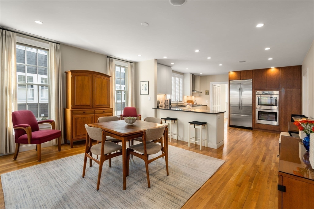 16 York Terrace Brookline, MA 02446 - Photo 7 of 42 a view of a dining room with furniture and wooden floor