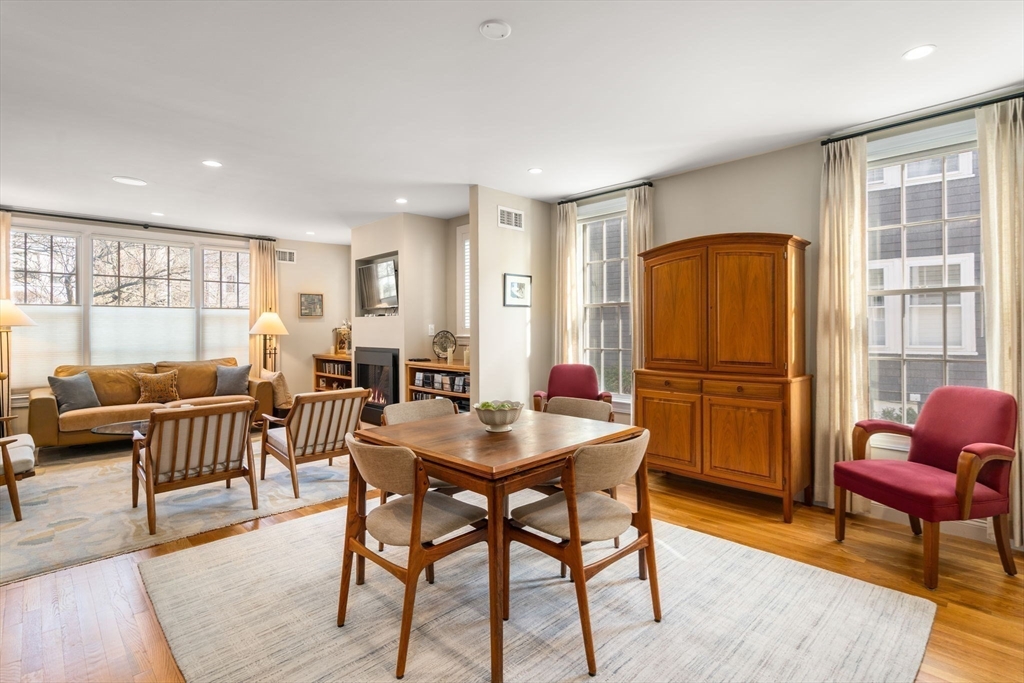 16 York Terrace Brookline, MA 02446 - Photo 10 of 42 a living room with furniture a refrigerator a table and chairs