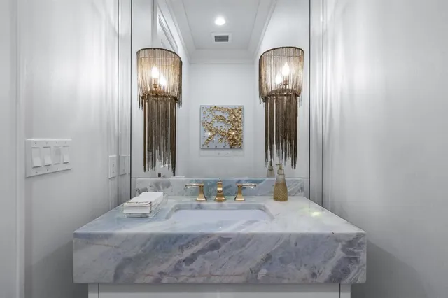 a bathroom with a sink and mirror