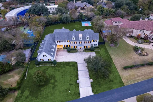 an aerial view of a houses with outdoor space