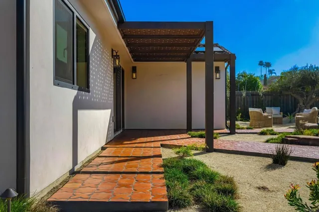 a backyard of a house with seating space