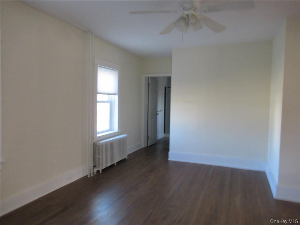 198 Big Island Road Warwick, NY 10990 - Photo 8 of 24 an empty room with wooden floor cabinet and windows