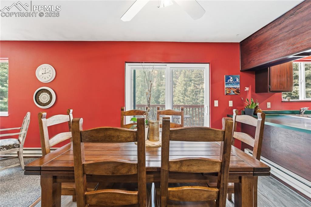 5130 Neeper Valley Road Manitou Springs, CO 80829 - Photo 11 of 38 a view of a dining room with furniture and window
