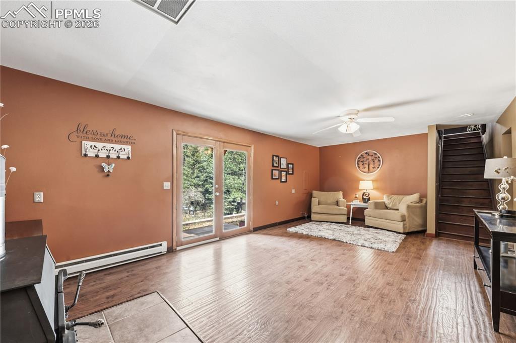 5130 Neeper Valley Road Manitou Springs, CO 80829 - Photo 22 of 38 a living room with furniture and a large window