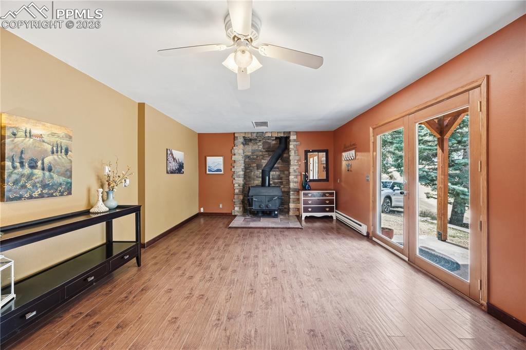 5130 Neeper Valley Road Manitou Springs, CO 80829 - Photo 23 of 38 wooden floor in an empty room with a window