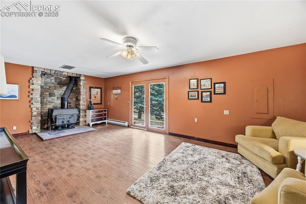 5130 Neeper Valley Road Manitou Springs, CO 80829 - Photo 24 of 38 a living room with furniture and a flat screen tv