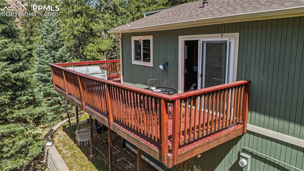 5130 Neeper Valley Road Manitou Springs, CO 80829 - Photo 34 of 38 a view of a balcony with wooden floor