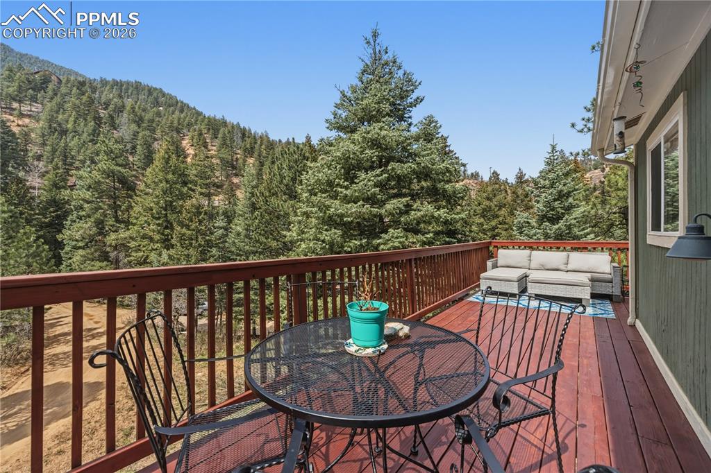 5130 Neeper Valley Road Manitou Springs, CO 80829 - Photo 6 of 38 a view of a chairs and table on the balcony