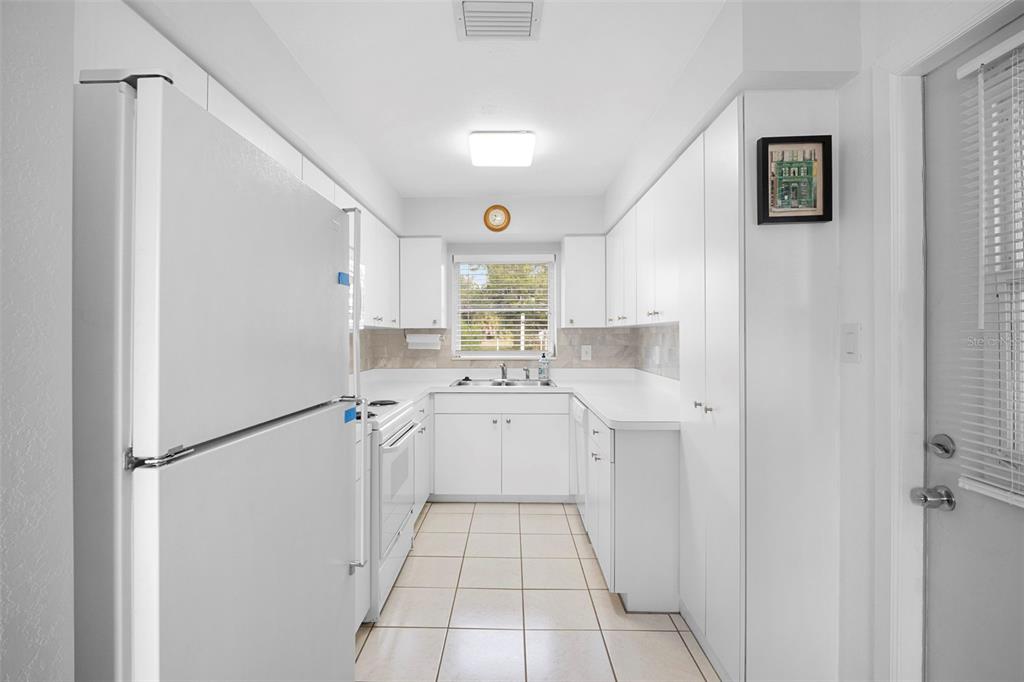 29098 Riverview Lane Punta Gorda, FL 33982 - Photo 11 of 35 a kitchen with a refrigerator a sink and dishwasher