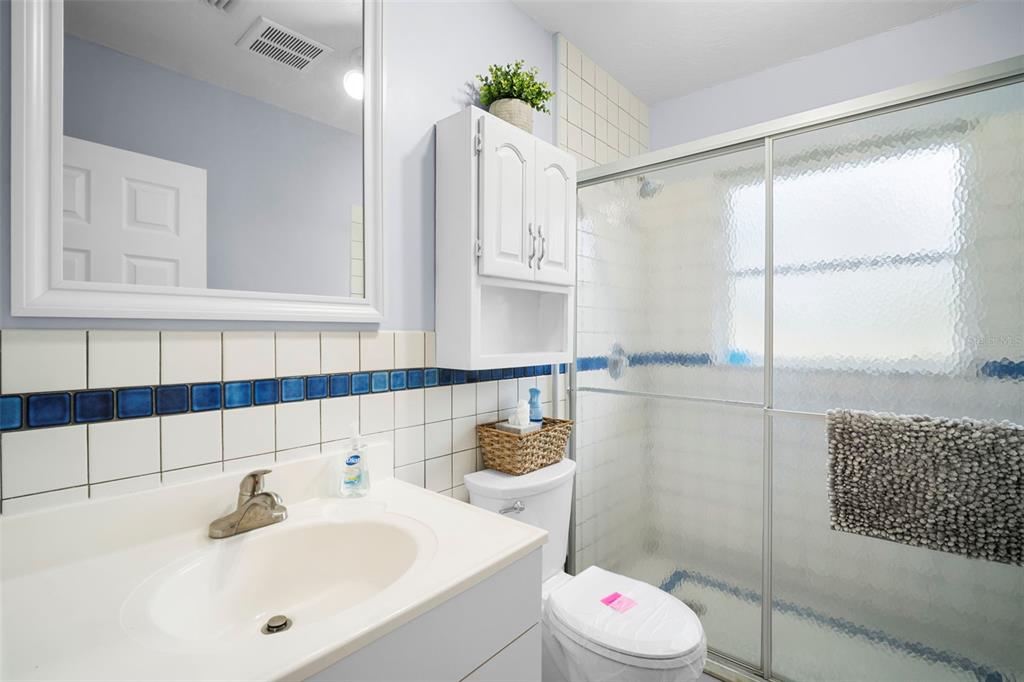 29098 Riverview Lane Punta Gorda, FL 33982 - Photo 15 of 35 a bathroom with a sink and a mirror