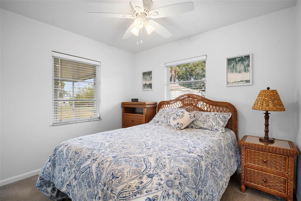 29098 Riverview Lane Punta Gorda, FL 33982 - Photo 16 of 35 a bedroom with a bed and a window