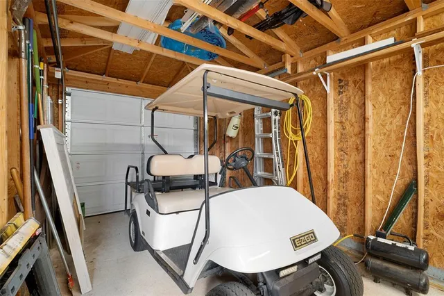 a view of a patio with a table chairs and garden