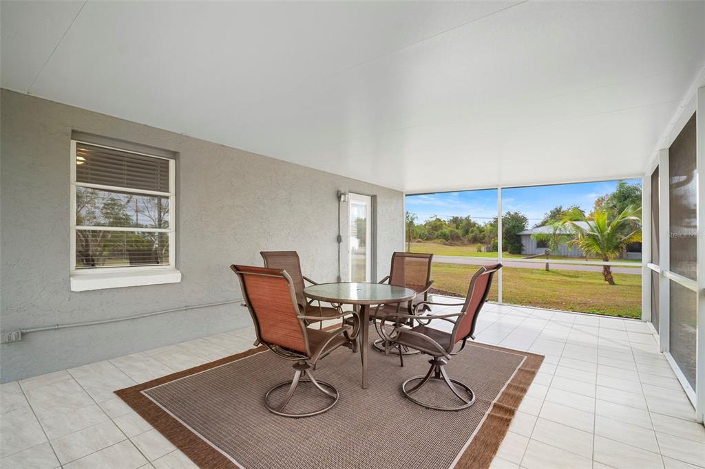 29098 Riverview Lane Punta Gorda, FL 33982 - Photo 28 of 35 a view of a dining room with furniture wooden floor and a rug