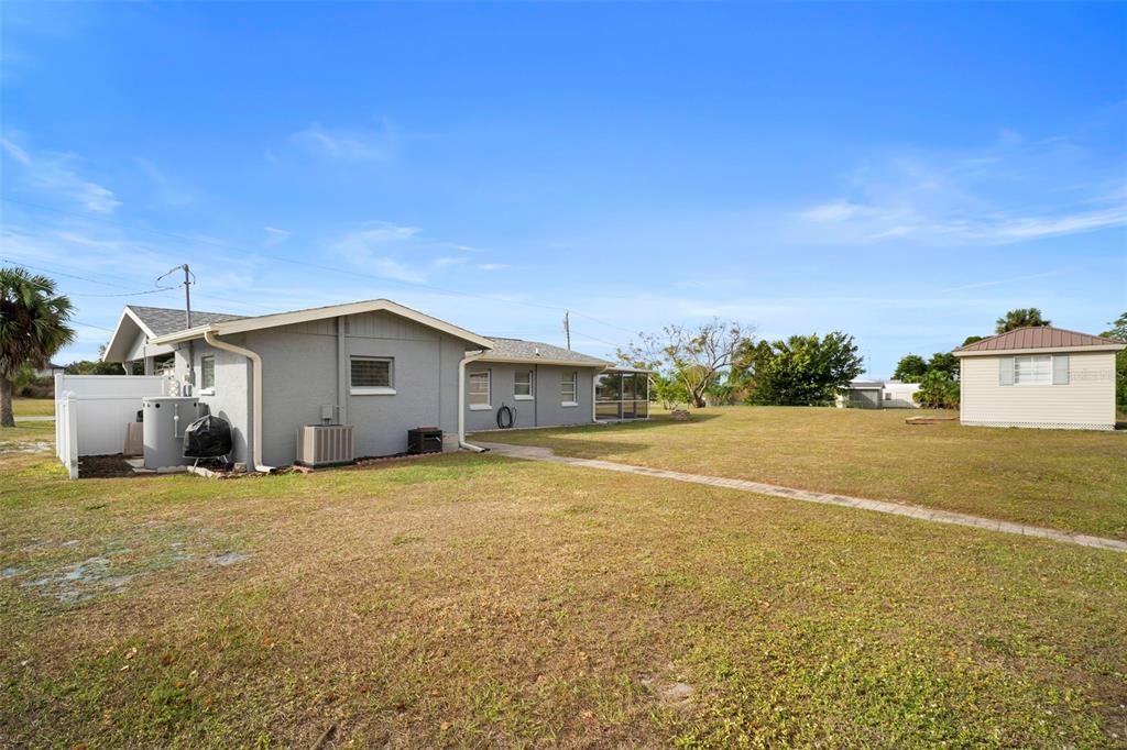 29098 Riverview Lane Punta Gorda, FL 33982 - Photo 30 of 35 a bathroom with a sink and a yard