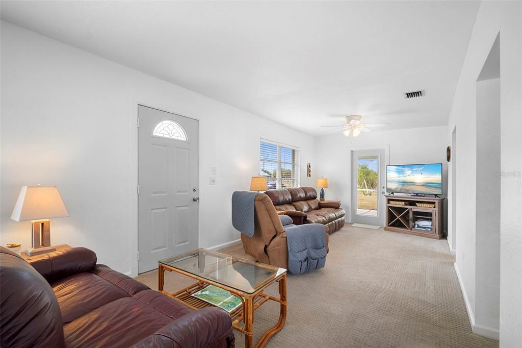 29098 Riverview Lane Punta Gorda, FL 33982 - Photo 4 of 35 a view of a livingroom with furniture and a couch