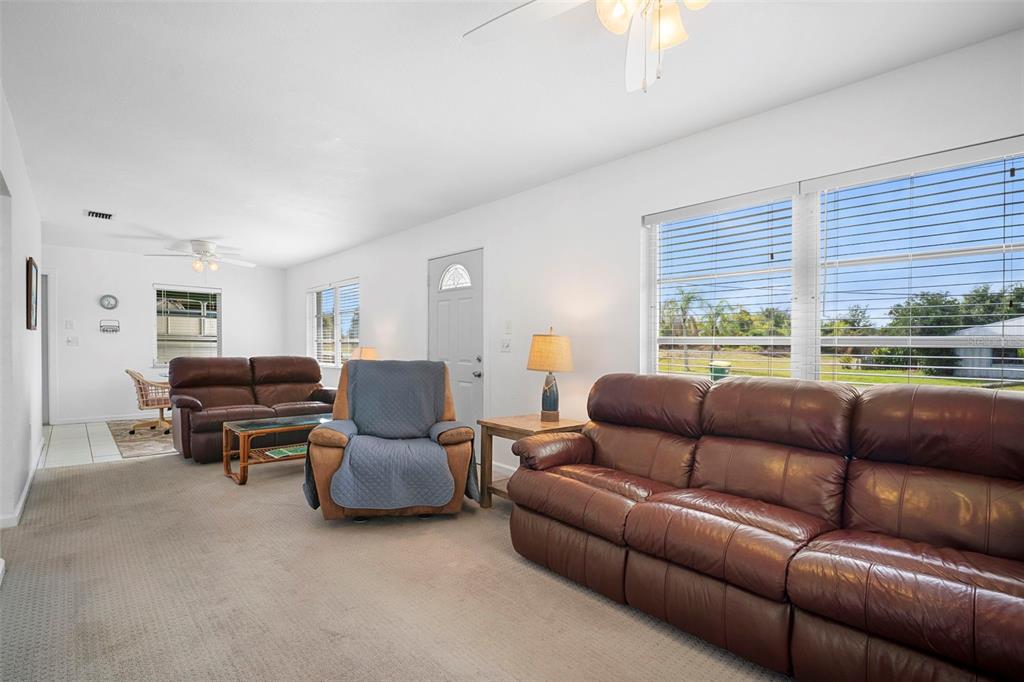 29098 Riverview Lane Punta Gorda, FL 33982 - Photo 6 of 35 a living room with furniture and a large window