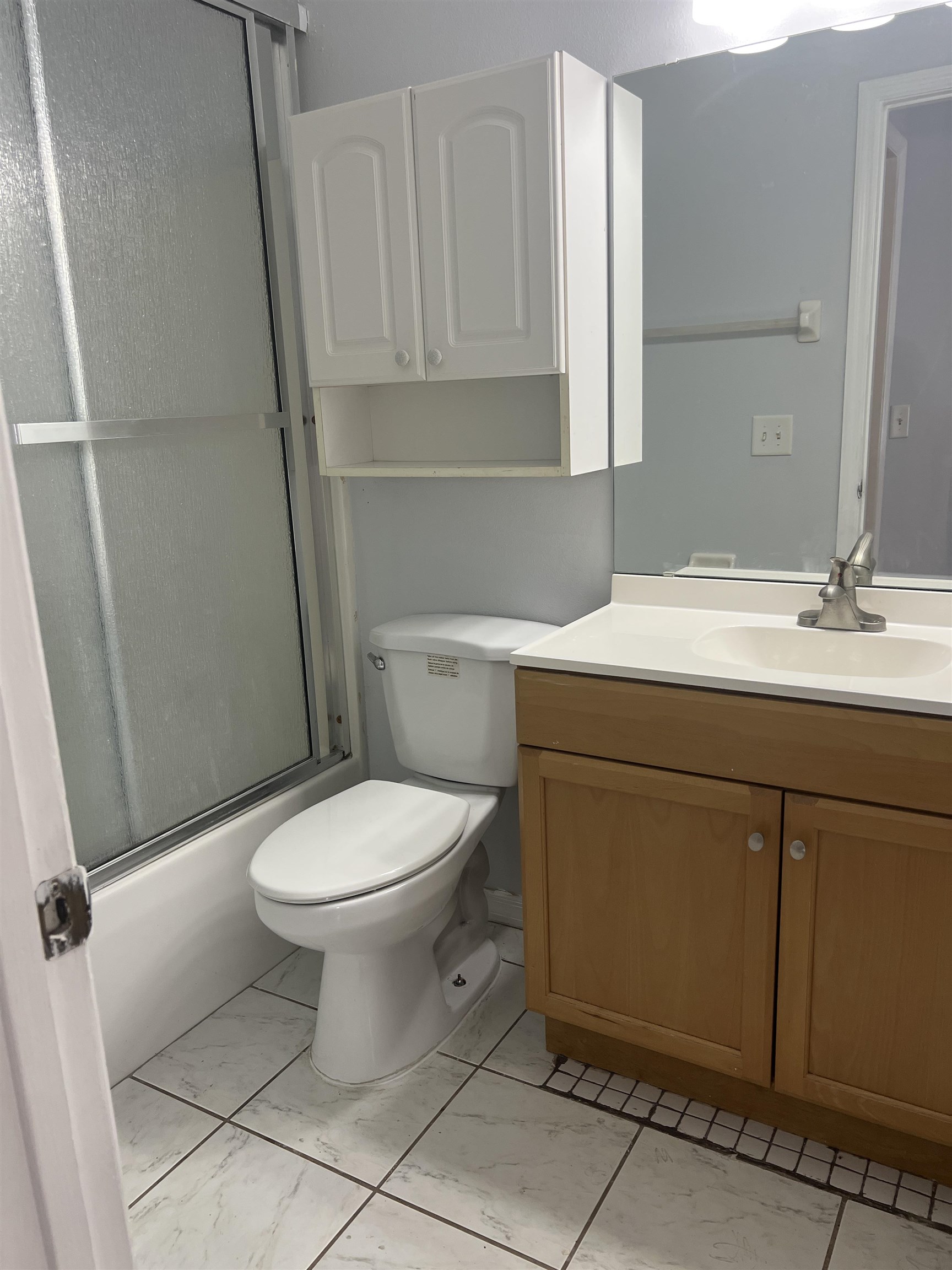5465 Datil Pepper Road St. Augustine, FL 32086 - Photo 11 of 28 a bathroom with a sink a toilet and a mirror
